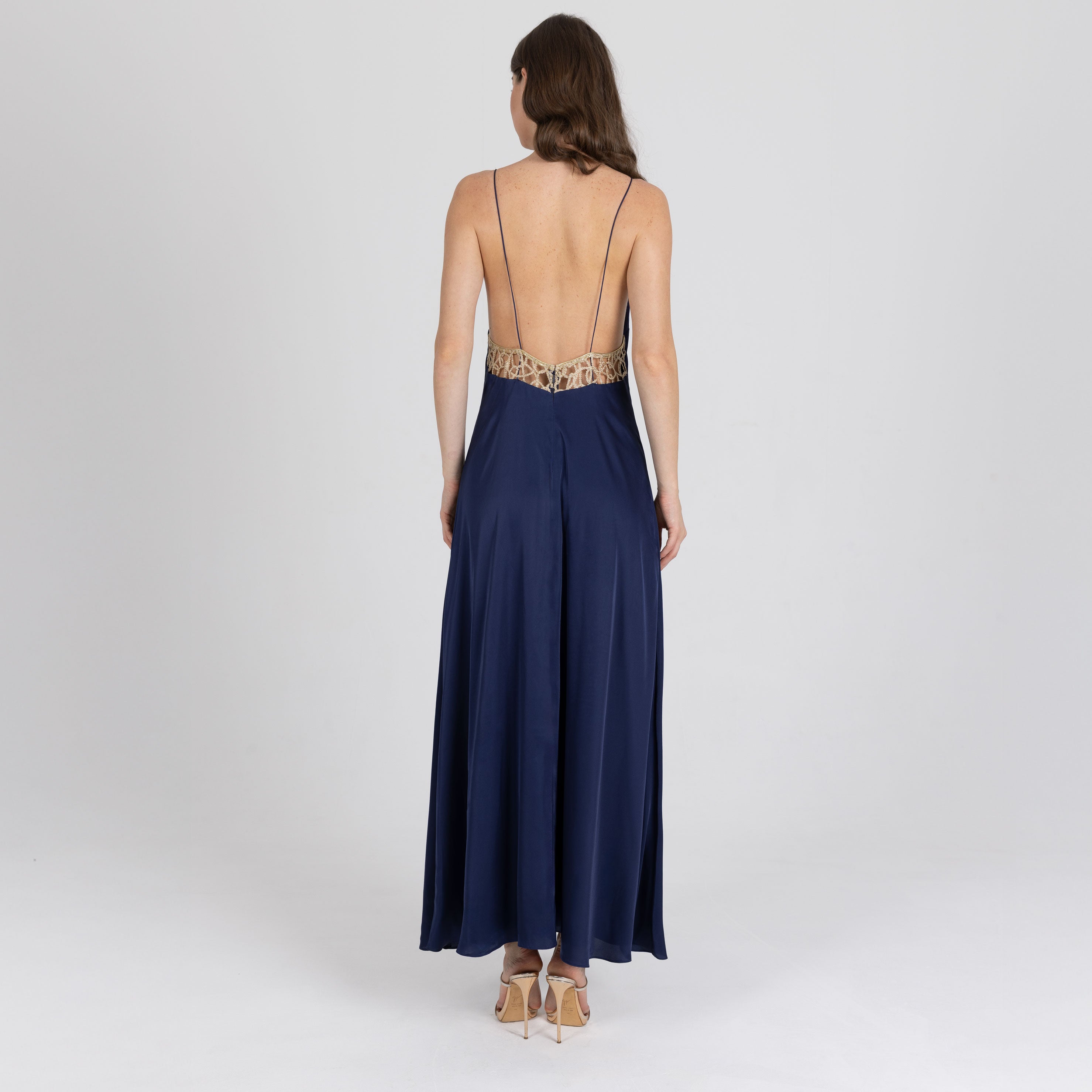 Fluid navy slip dress with embroidered golden lace back and tone-on-tone straps