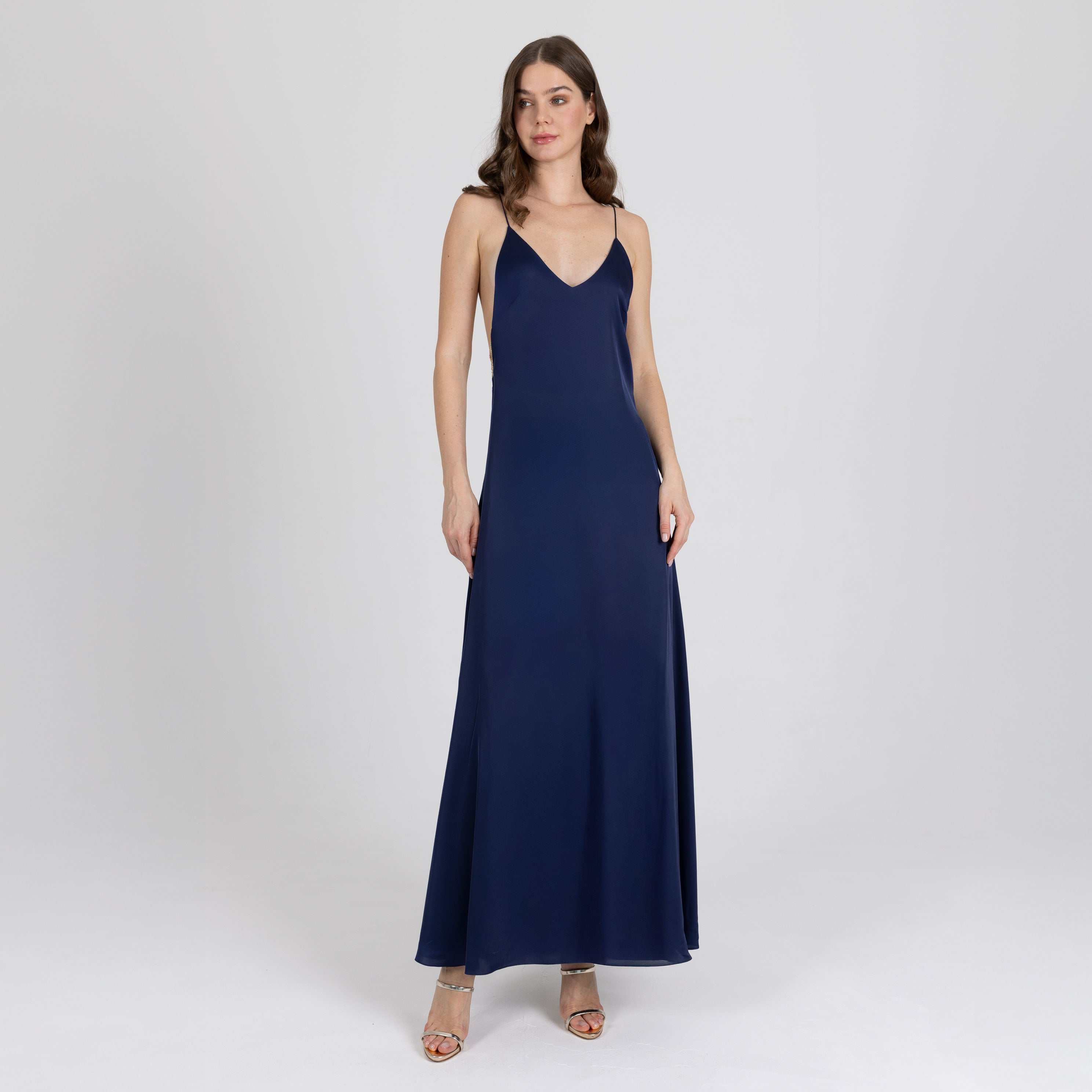 Model wearing navy blue satin slip dress with deep V neckline – Sireya by A|LOUD