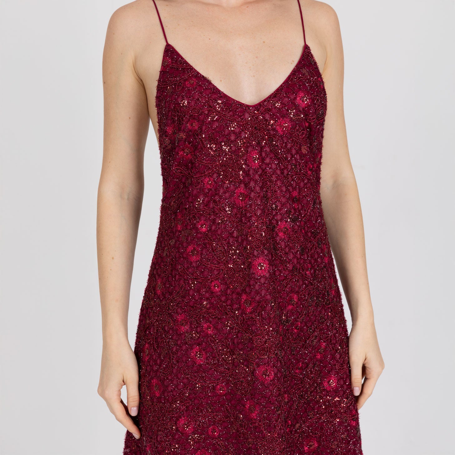 Close-up of deep V neckline and textured red embroidery – Vedra slip dress by A|LOUD