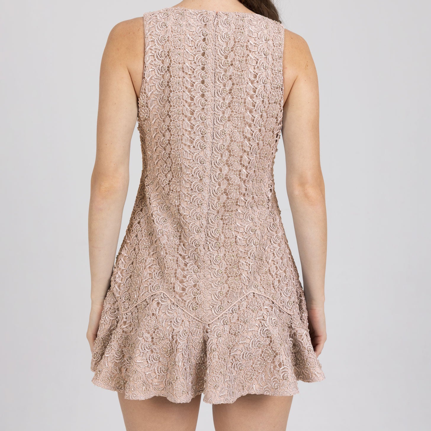 Back view of Zayra Mini Dress – flounced hem and geometric piping detail