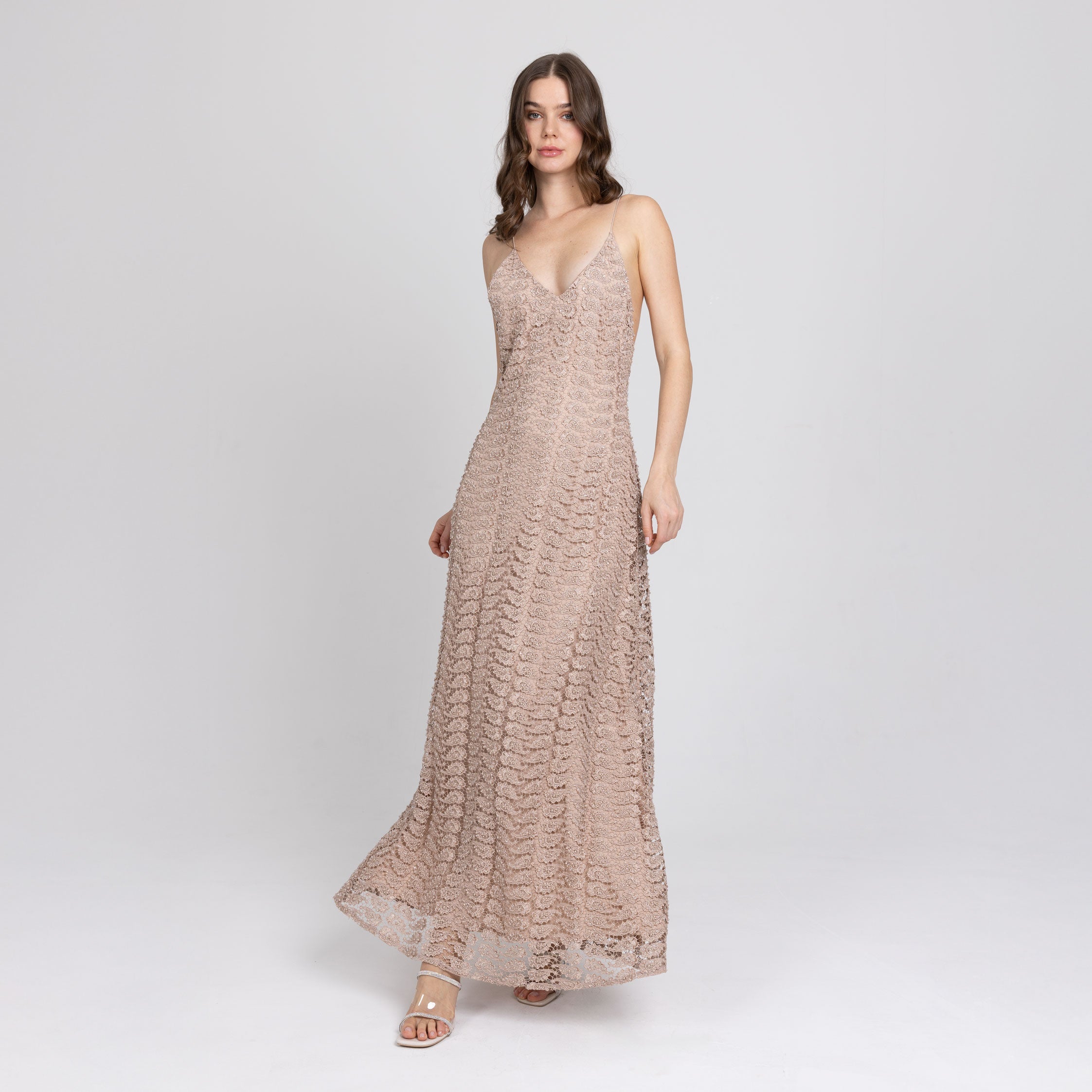 Close-up of golden lace insert on backless navy satin gown – handcrafted detailing