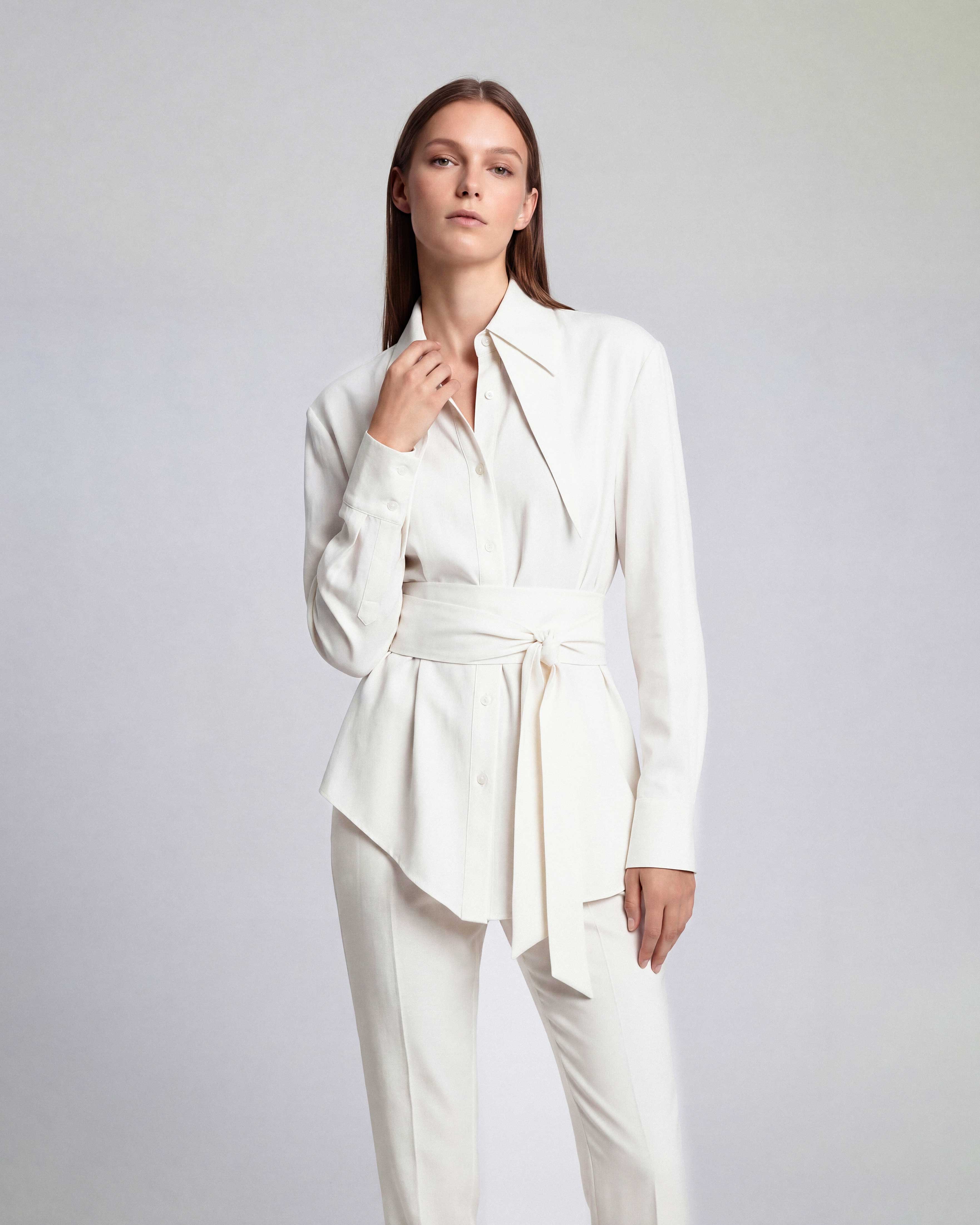 White linen tie waist shirt with sculpted silhouette and elongated collar