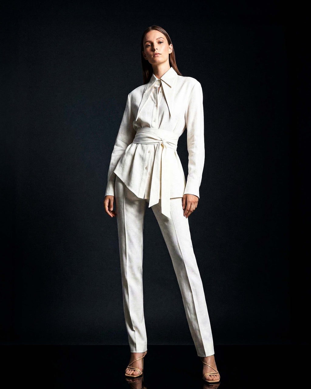 White linen shirt styled with matching tailored trousers