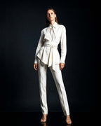 White linen shirt styled with matching tailored trousers