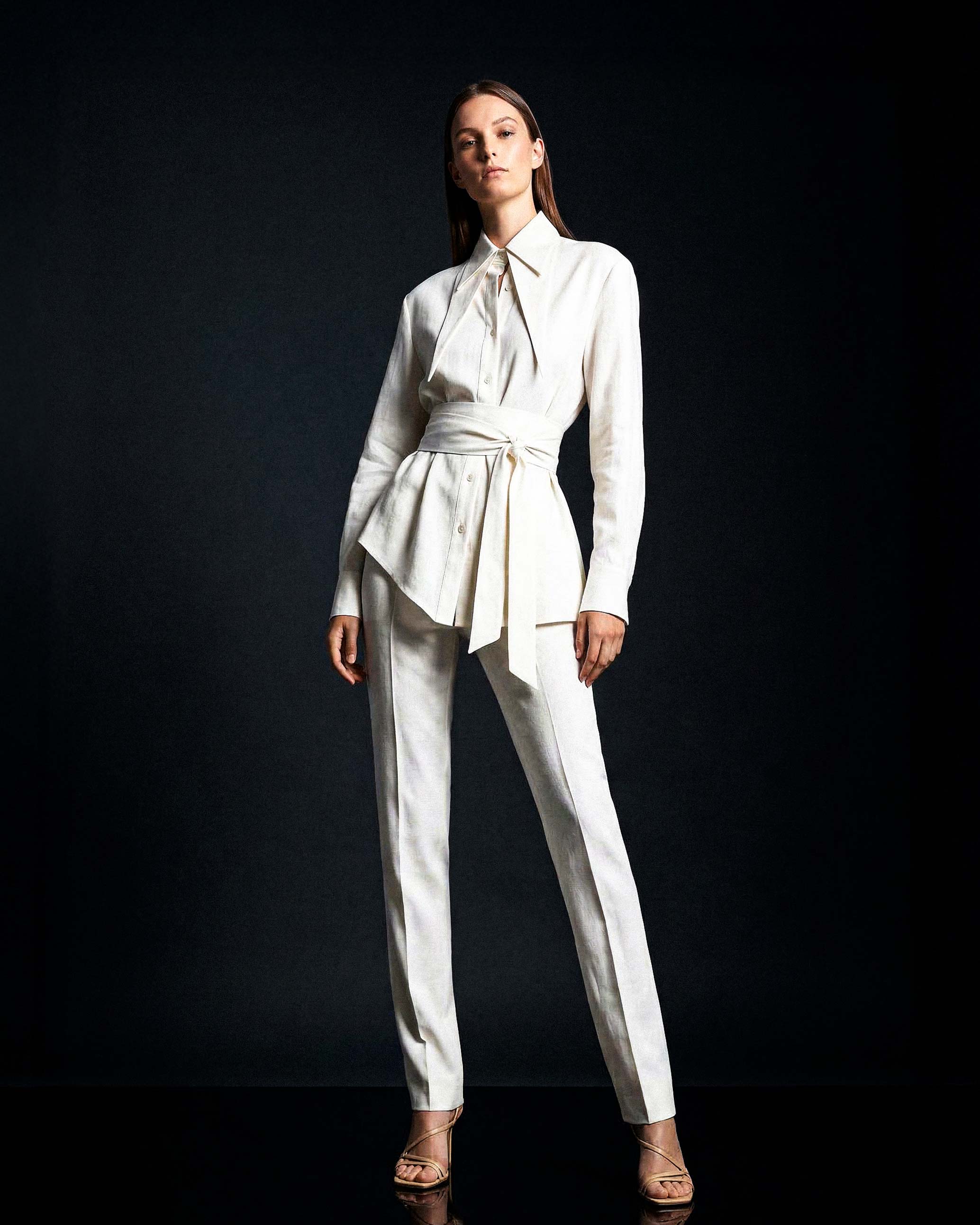 White linen shirt styled with matching tailored trousers