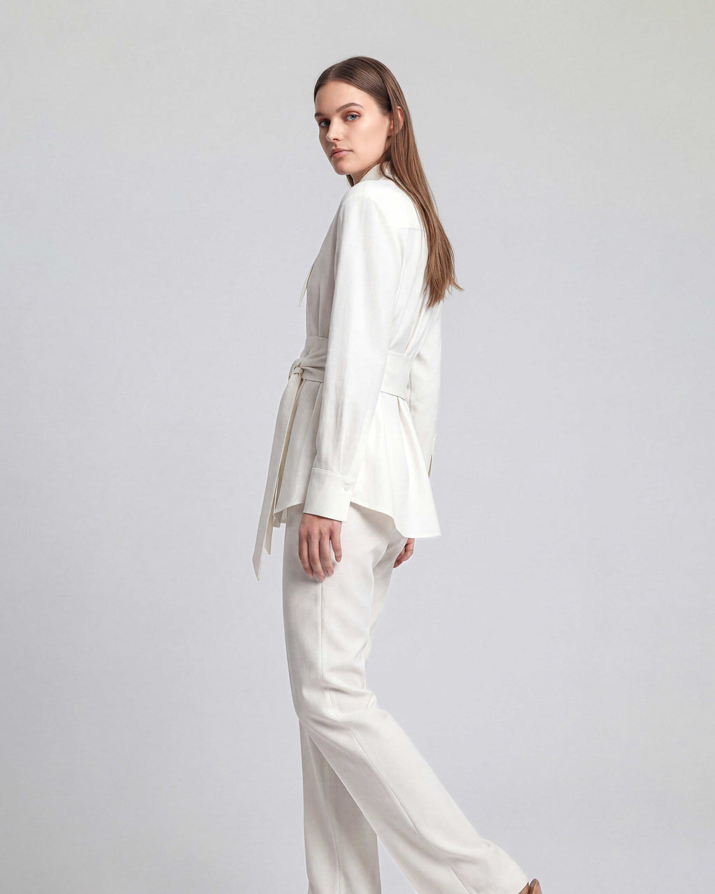 Side view of white linen shirt with sculpted silhouette
