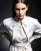 Tie waist detail on white linen shirt