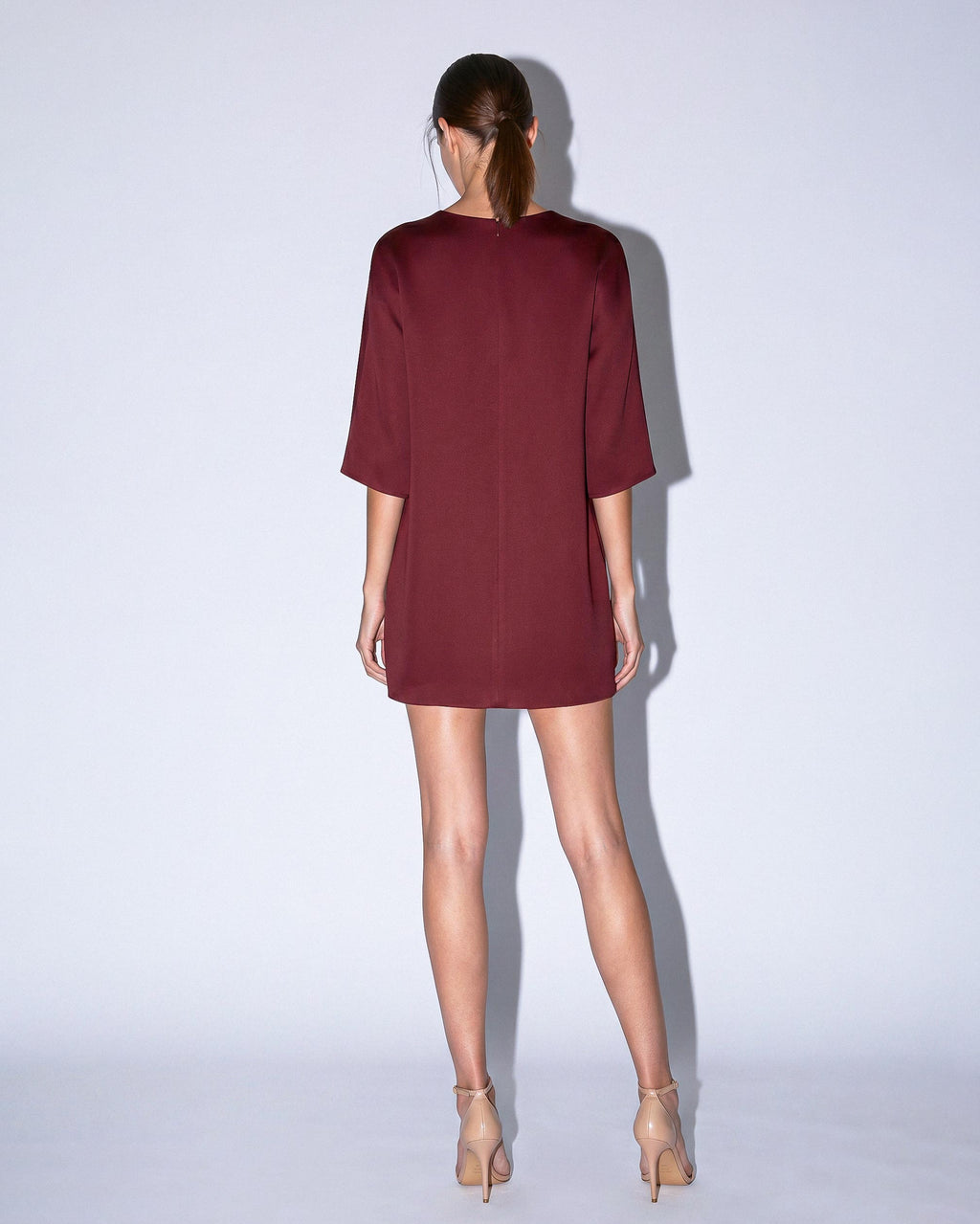 Back view of KADEN burgundy structured short dress by A|LOUD with clean minimal finish