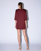 Back view of KADEN burgundy structured short dress by A|LOUD with clean minimal finish