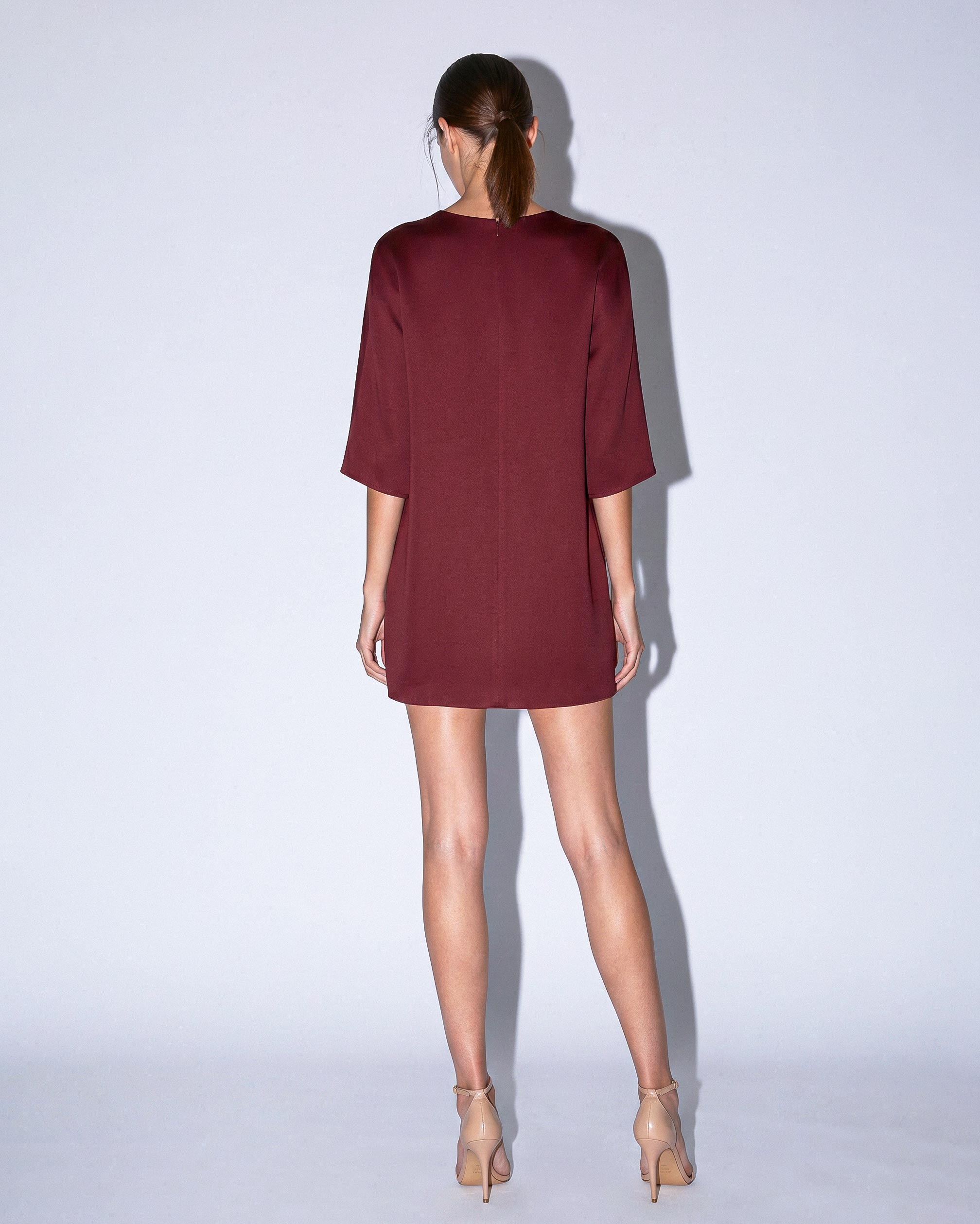 Back view of KADEN burgundy structured short dress by A|LOUD with clean minimal finish