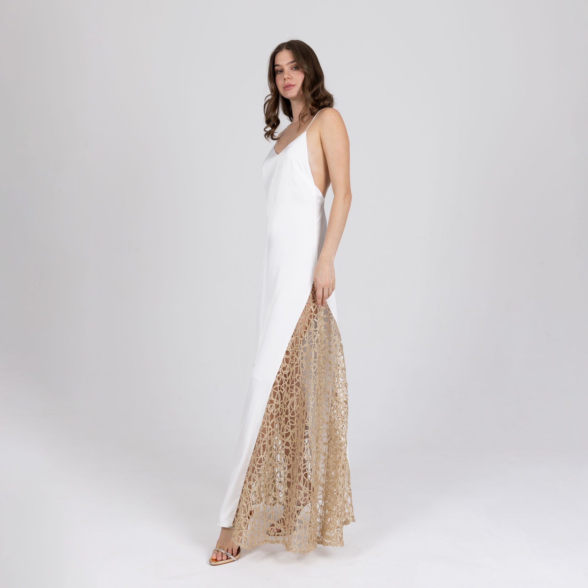 Model wearing long satin evening dress with gold lace inserts – Calie Long Dress