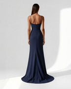Back view of navy crepe gown with thin straps and soft mermaid hem