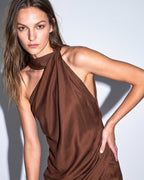 Close-up of ALMERA asymmetric mini dress with sculpted neckline detail