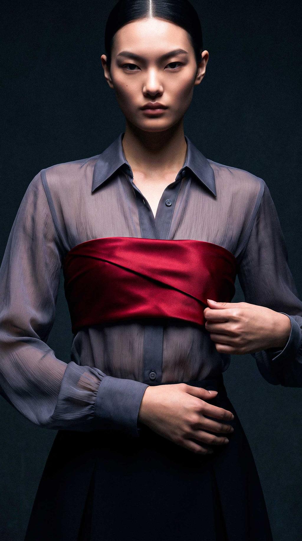 Front editorial view of the ÉLYR burgundy silk satin bandeau styled over a sheer charcoal silk chiffon shirt by A|LOUD