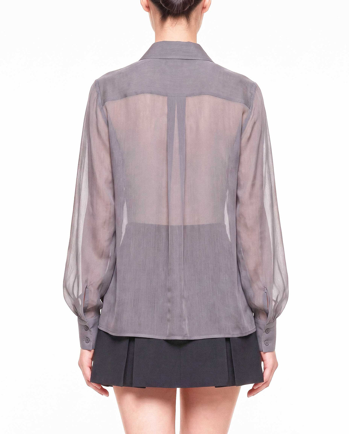Back detail of the ÉLYR sheer charcoal silk chiffon shirt showing the transparent silk chiffon, back yoke and voluminous sleeves by A|LOUD