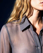 Close-up detail of the ÉLYR sheer charcoal silk chiffon shirt with pointed collar and transparent silk texture by A|LOUD