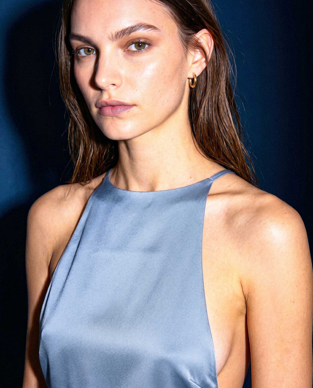 Editorial close-up of KIELA light blue satin halter top neckline detail by A\|LOUD