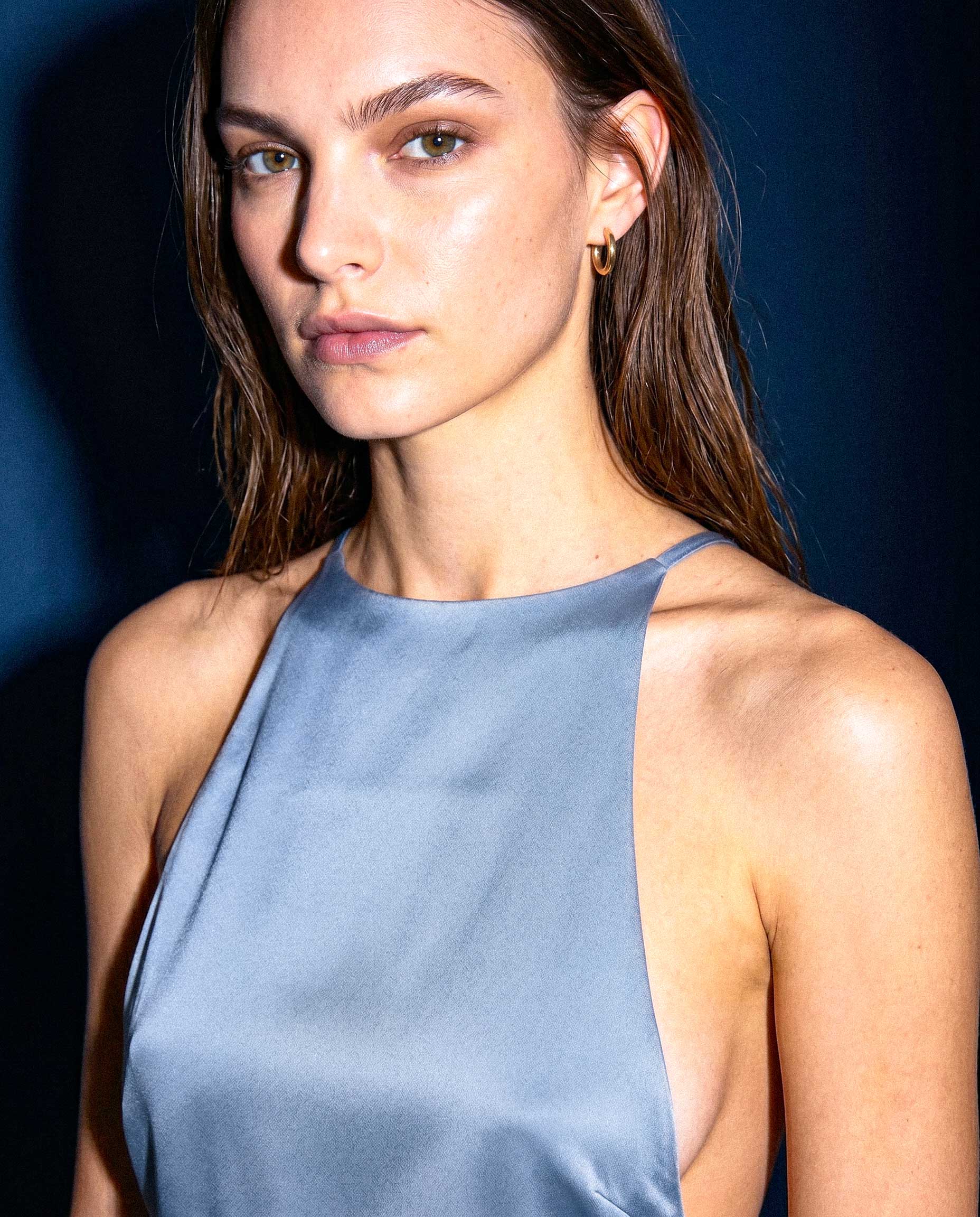 Editorial close-up of KIELA light blue satin halter top neckline detail by A\|LOUD