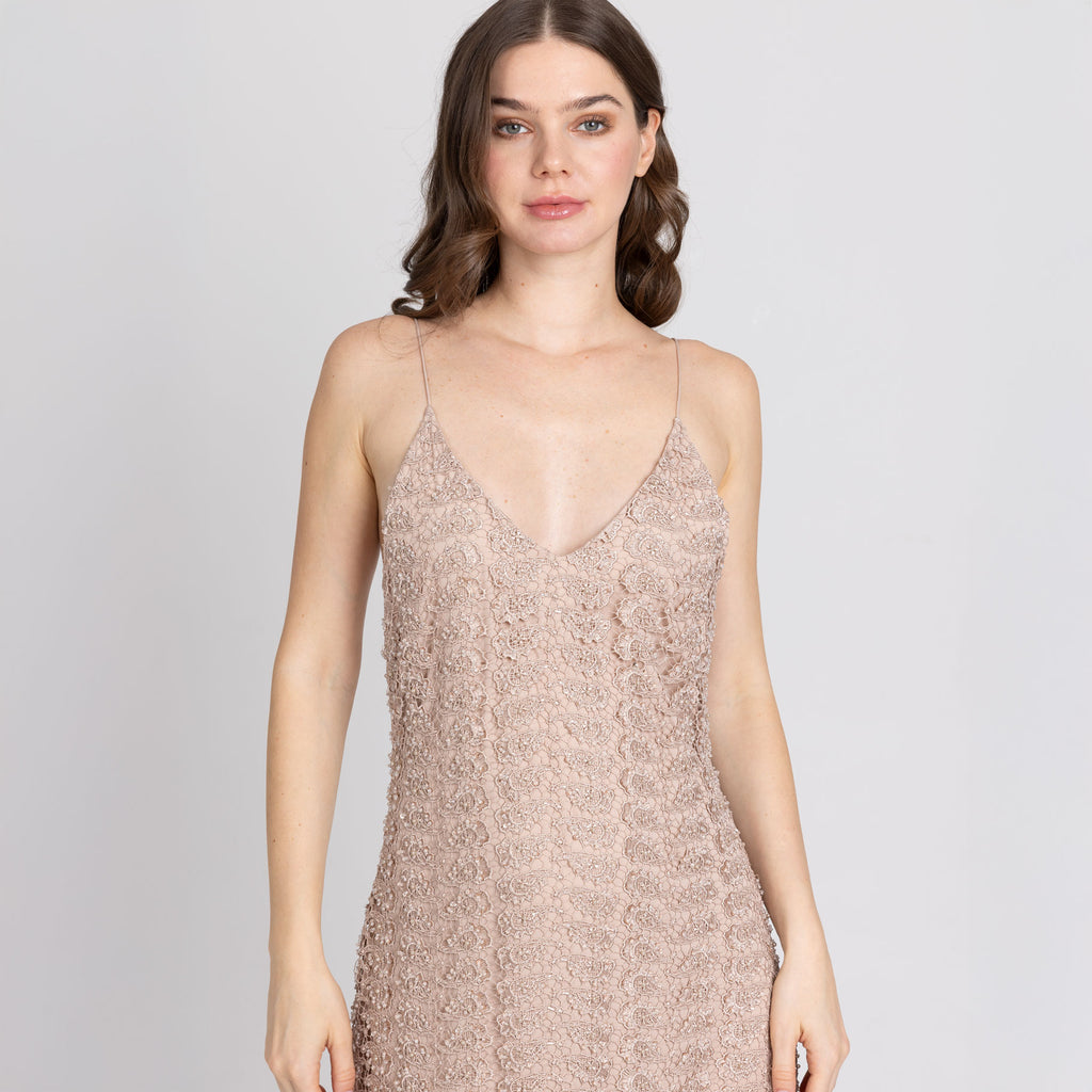 Close-up of neckline and bodice of nude lace dress – tonal stitching and texture