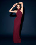 Front view of VIRENNE burgundy halter column gown with cross neckline by A\|LOUD