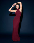Front view of VIRENNE burgundy halter column gown with cross neckline by A\|LOUD