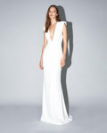 ISARA white evening gown with deep V neckline and sculpted shoulders
