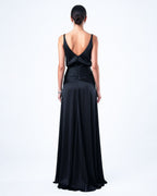 Back view of black satin evening gown with open back