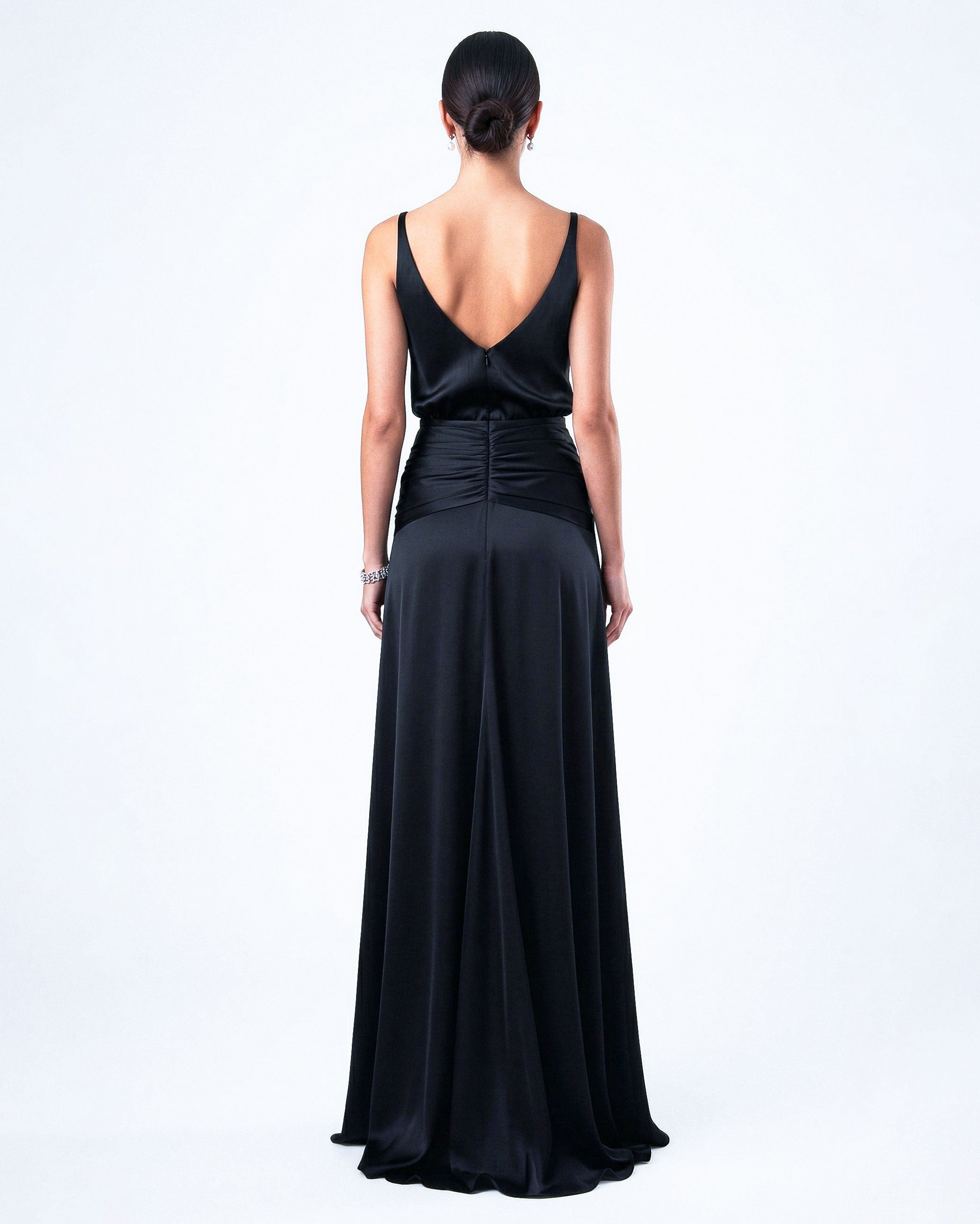 Back view of black satin evening gown with open back