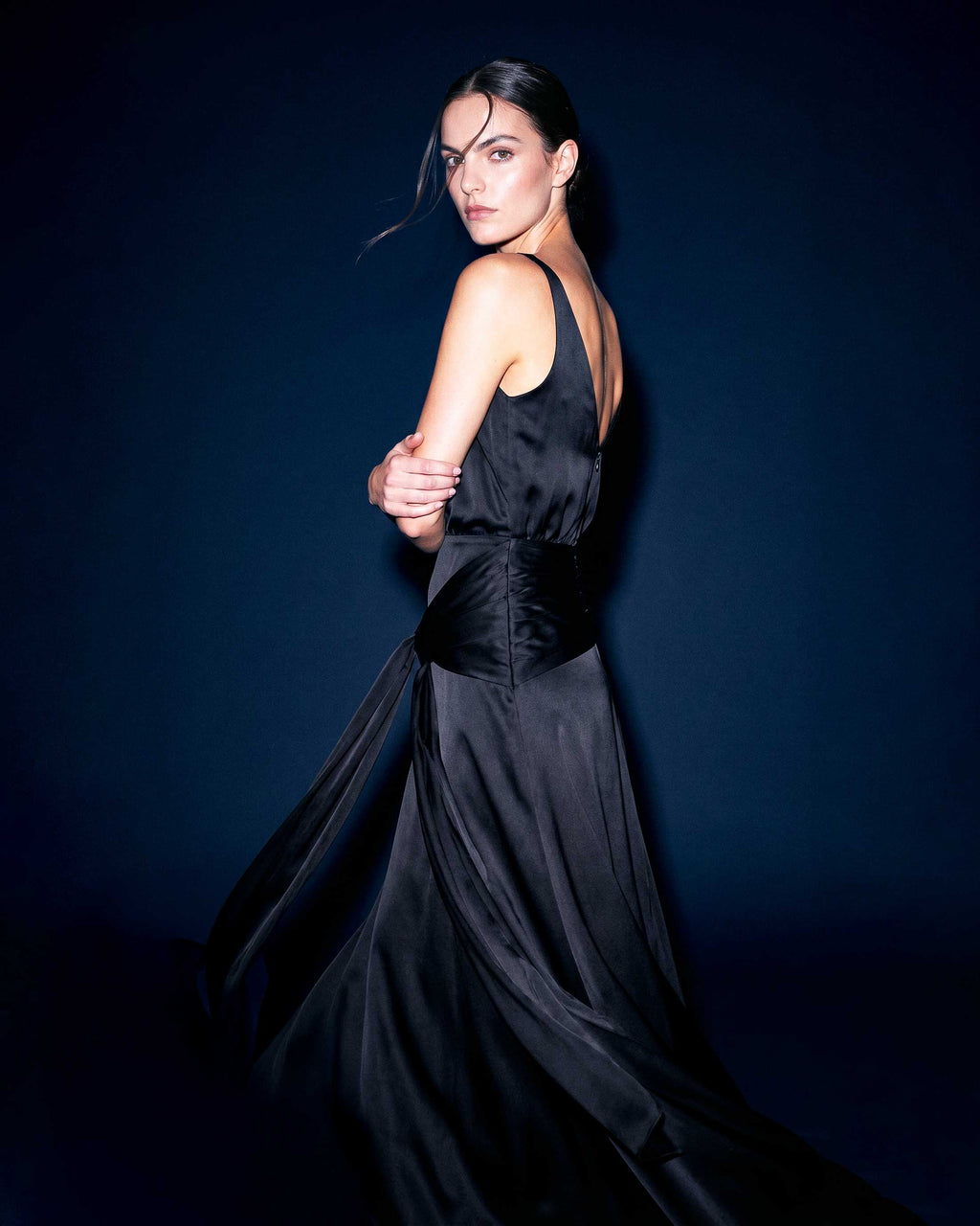  Close-up portrait wearing black satin evening dress with draped bodice