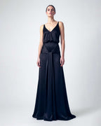 black satin evening dress with deep V neckline and draped waist