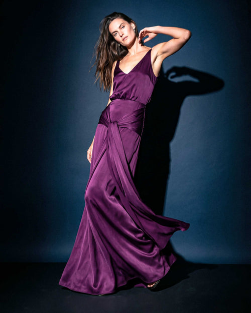 Marlene purple satin evening gown with draped waist detail and flowing skirt