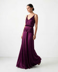 purple satin evening dress with deep V neckline and draped waist detail