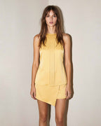 Butter yellow halter top in silk satin with fluid silhouette