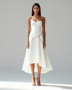 Front view of Nayla midi dress in white satin with sculpted bodice and flowing wrap-effect skirt