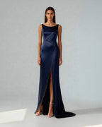 Model wearing Nyra gown – front view, showcasing the copper piping and front slit