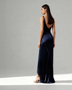 Full back view of Nyra gown in navy satin with geometric piping lines