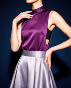 Front detail of the plum silk satin top showing the high neckline and deep side opening over a separate black bandeau.