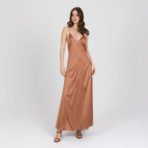 Model wearing copper satin long dress with deep V neckline – Seréa by A|LOUD