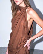 Side view of ALMERA asymmetric open back mini dress in fluid cupro