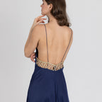 Navy satin gown with golden lace back detail and ultra-thin straps – elegant evening look