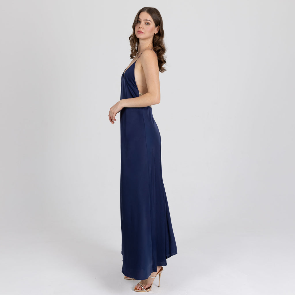Side profile of long satin dress with soft flare and low open back – Sireya dress handmade in Dubai