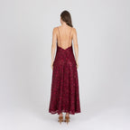 Back view of red floor-length gown with tonal embroidery and light shaping – handmade