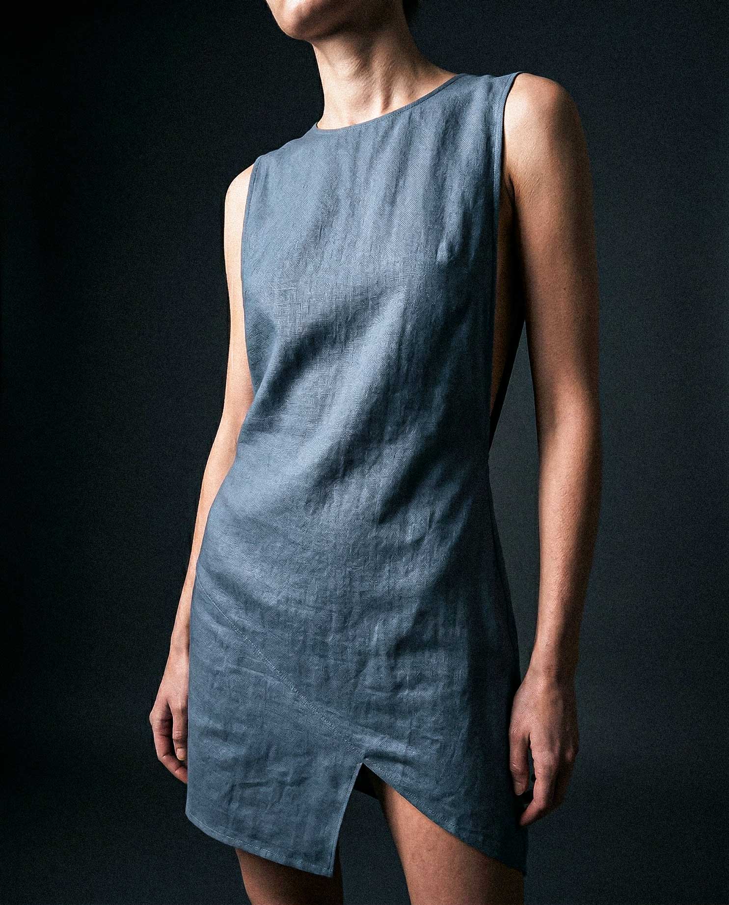 Asymmetrical linen mini dress in blue with structured silhouette