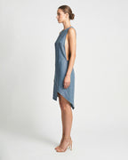 Side view of blue linen mini dress with asymmetrical hemline
