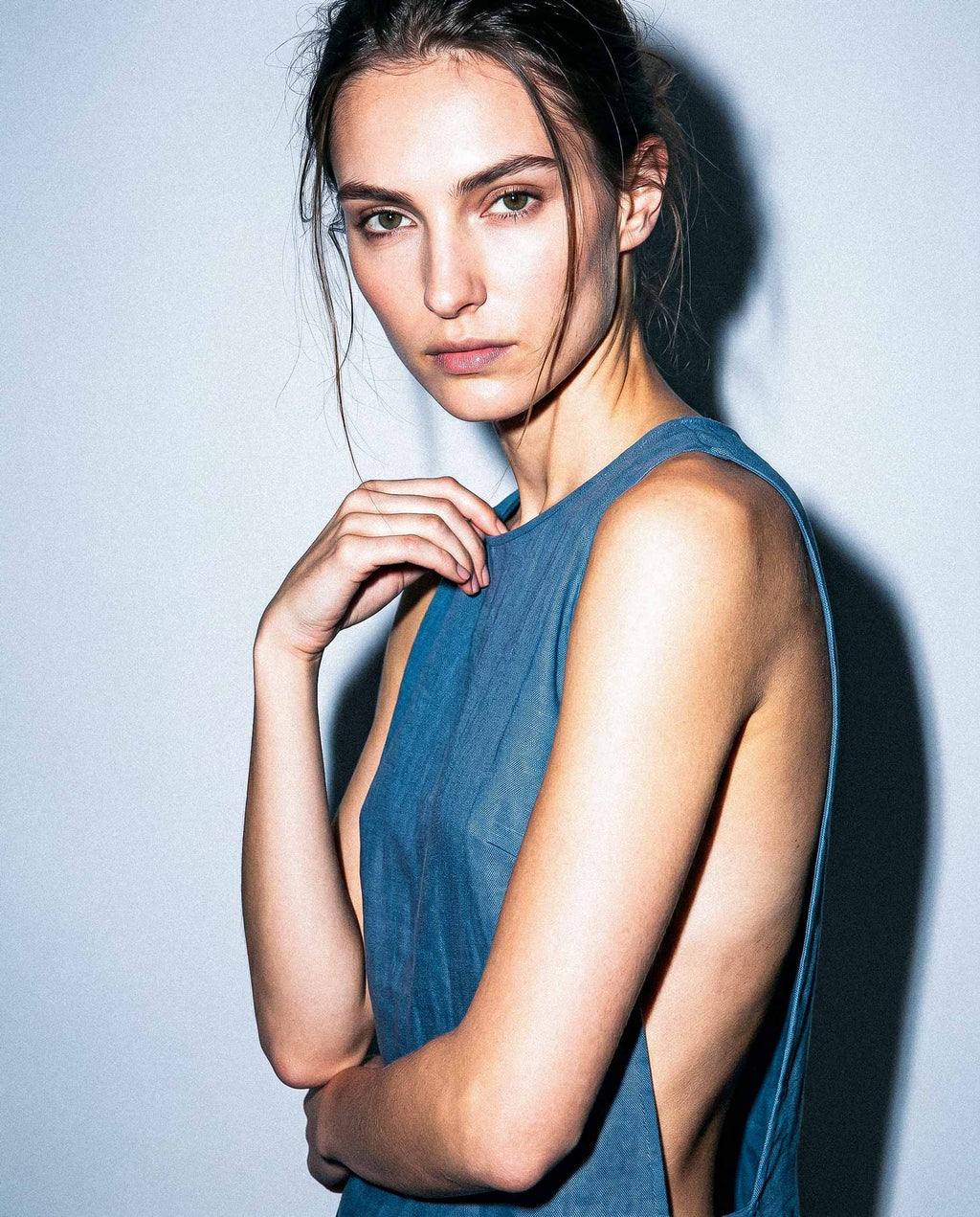 Sleeveless blue linen mini dress with clean neckline 