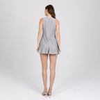 Back view of Zayra grey lace mini dress – geometric flounce and modern tailoring