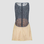 Flat back view – sheer embroidered back and yellow flared skirt