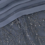 Close-up of blue beaded embroidery on Muse Gown fabric