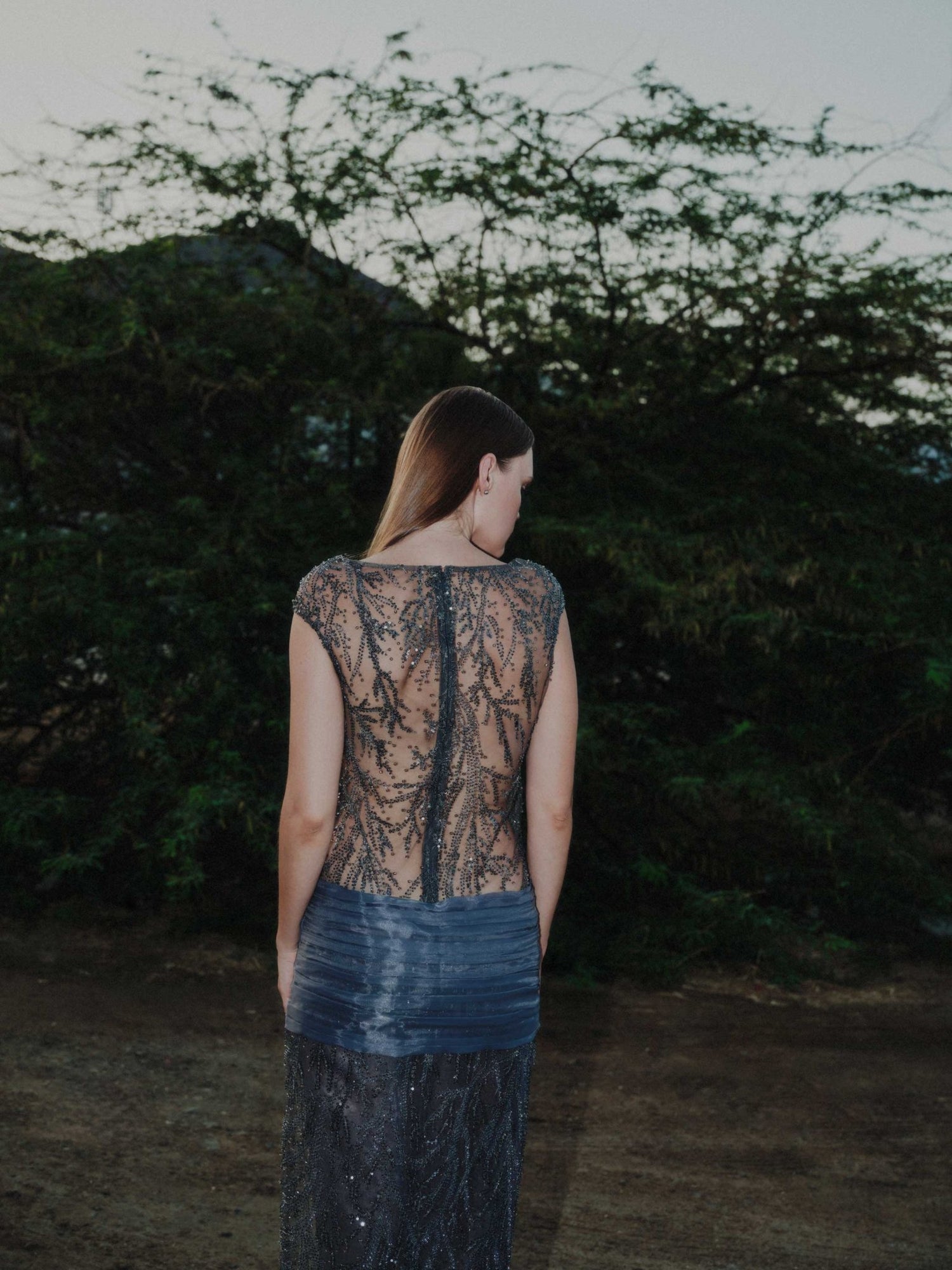 Back view of embroidered Muse Gown in grey tulle