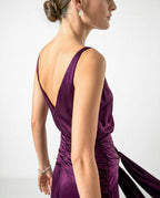 Open back detail on purple satin evening dress